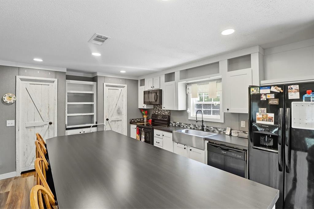 4801 North Mattox Point Crystal River, FL 34428 - Photo 3 of 46 a kitchen with stainless steel appliances granite countertop a stove refrigerator and a refrigerator
