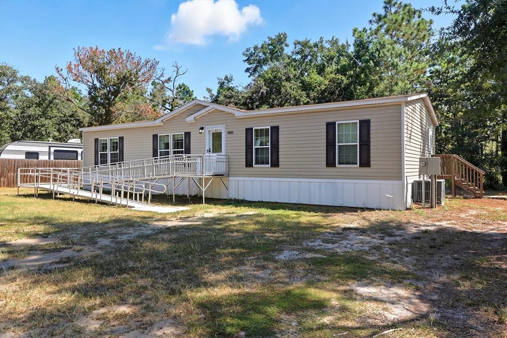 4801 North Mattox Point Crystal River, FL 34428 - Photo 40 of 46 a front view of a house with a yard