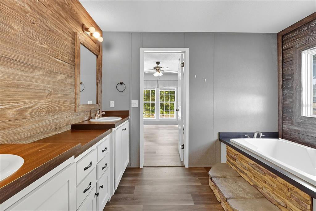 4801 North Mattox Point Crystal River, FL 34428 - Photo 5 of 46 a spacious bathroom with double vanity and a mirror