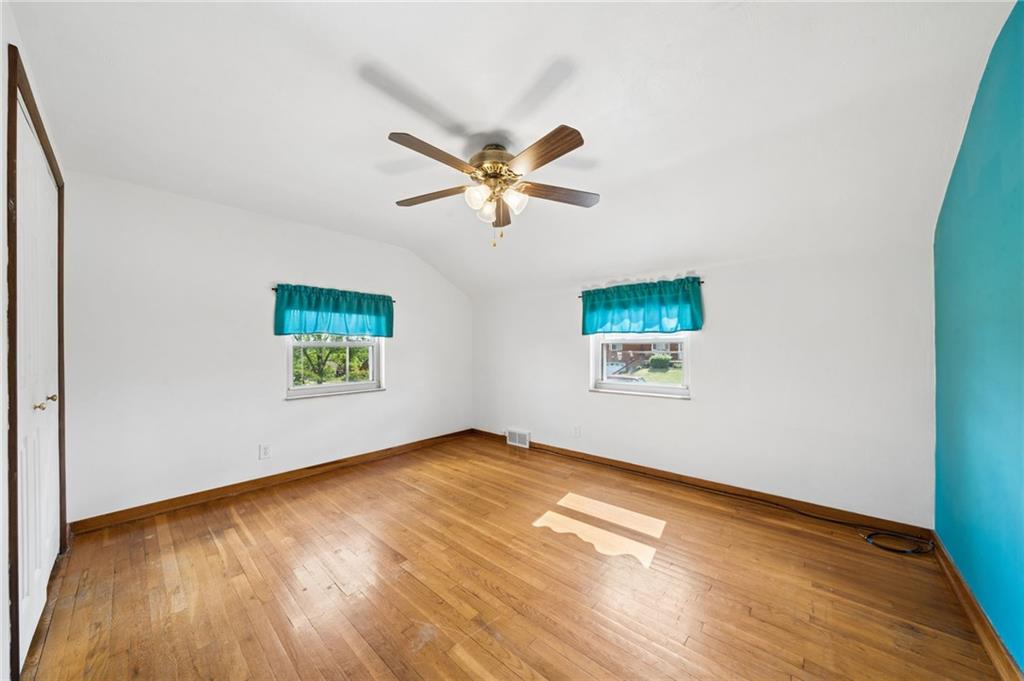 711 Jane Street Pittsburgh, PA 15239 - Photo 10 of 27 Complete with a modern ceiling fan and a large closet for all your storage needs.