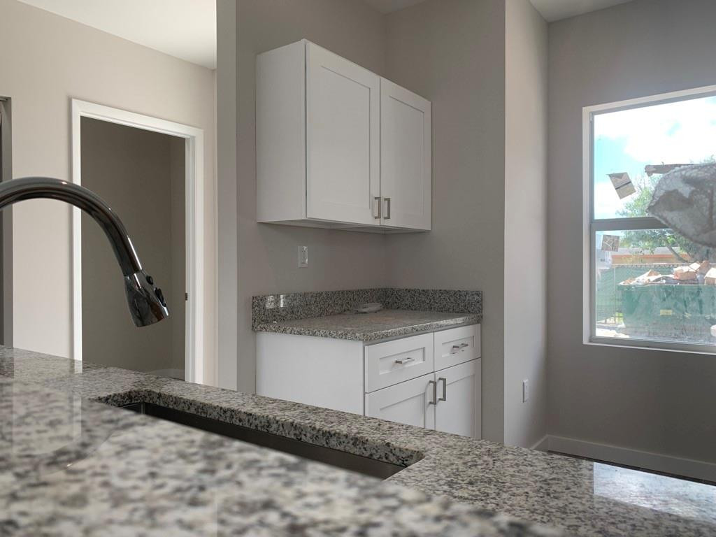 309 Foster Road, Unit 7 Hallandale Beach, FL 33009 - Photo 19 of 53 a view of a kitchen with a sink