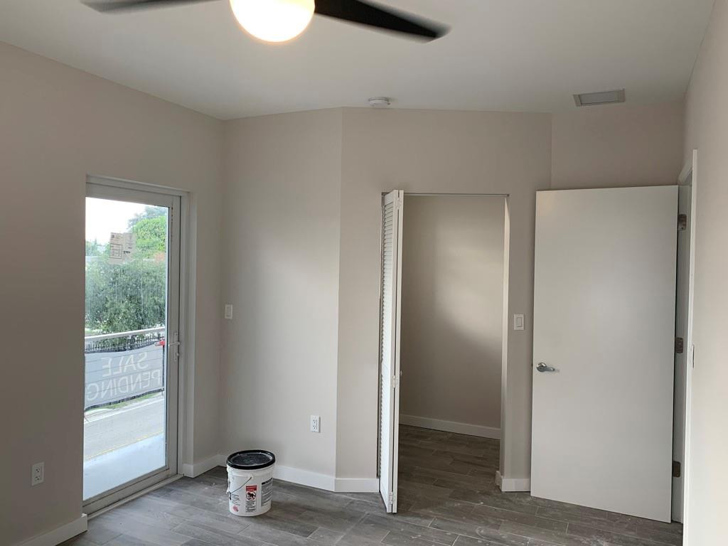 309 Foster Road, Unit 7 Hallandale Beach, FL 33009 - Photo 29 of 53 a view of a room with wooden floor and a window