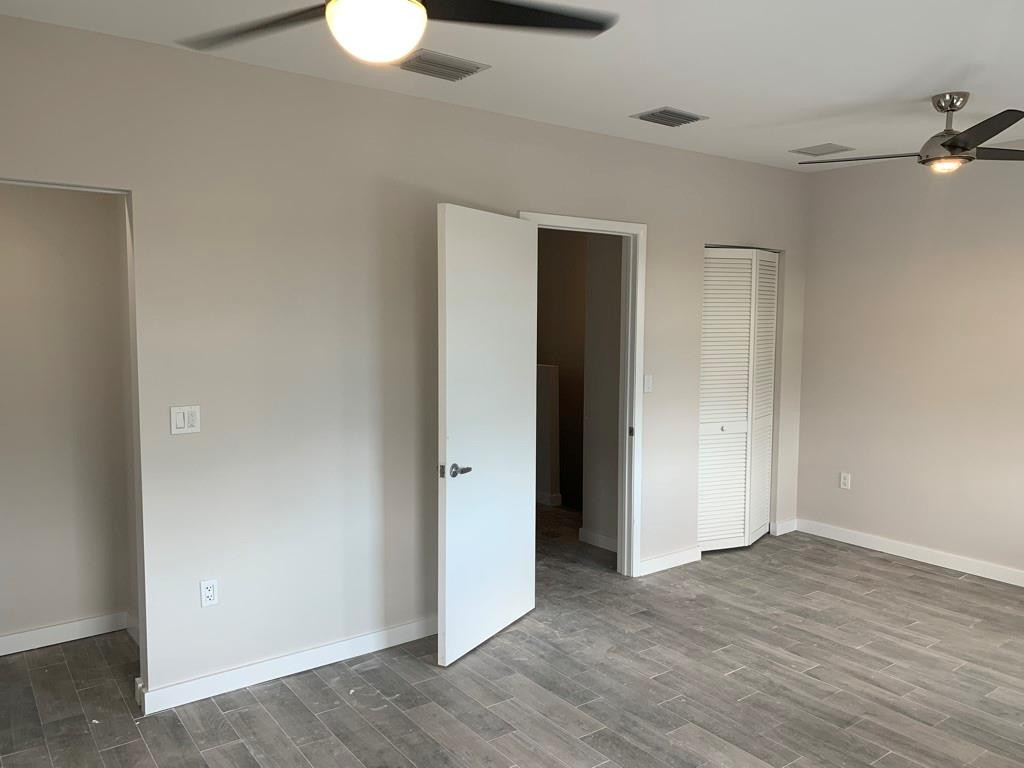 309 Foster Road, Unit 7 Hallandale Beach, FL 33009 - Photo 30 of 53 a view of an empty room with wooden floor