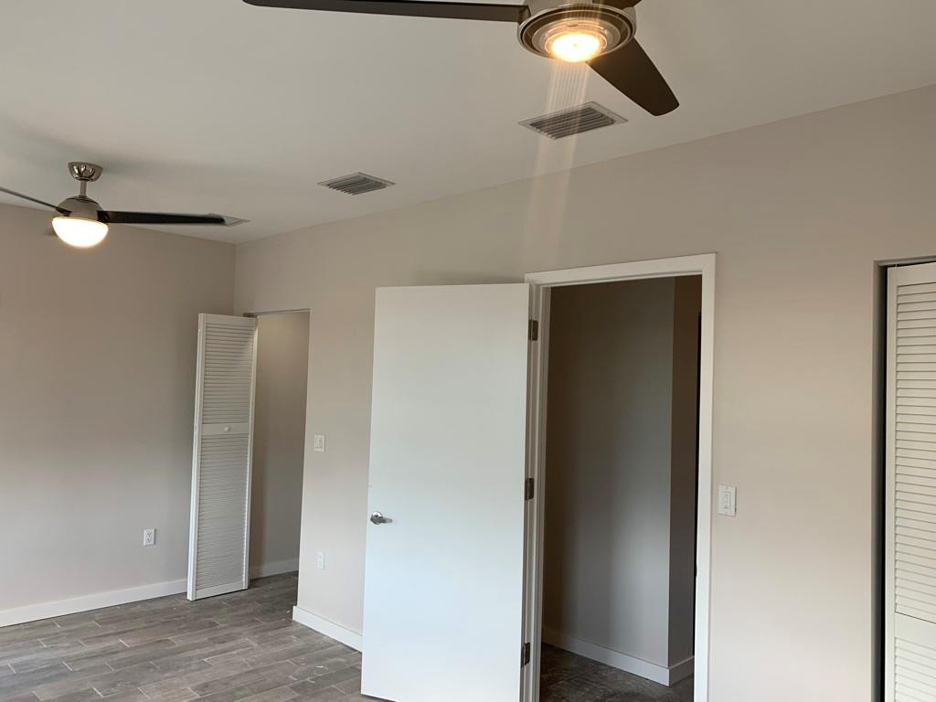 309 Foster Road, Unit 7 Hallandale Beach, FL 33009 - Photo 32 of 53 a view of a livingroom with a ceiling fan and window