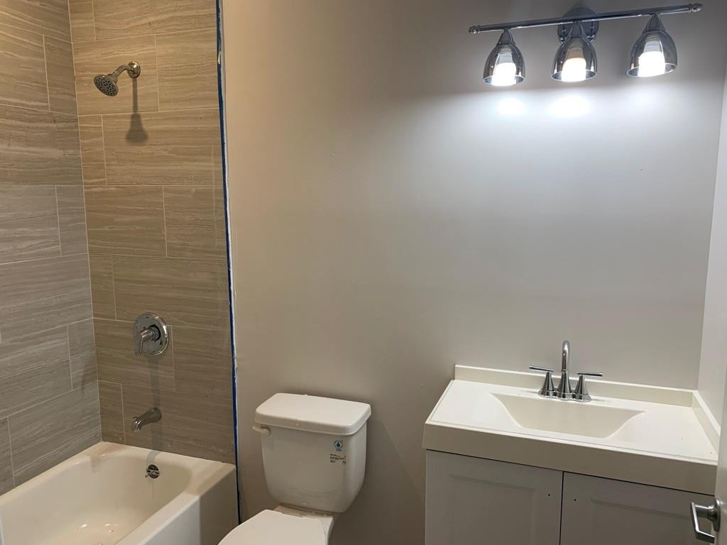 309 Foster Road, Unit 7 Hallandale Beach, FL 33009 - Photo 34 of 53 a bathroom with a sink a toilet and shower