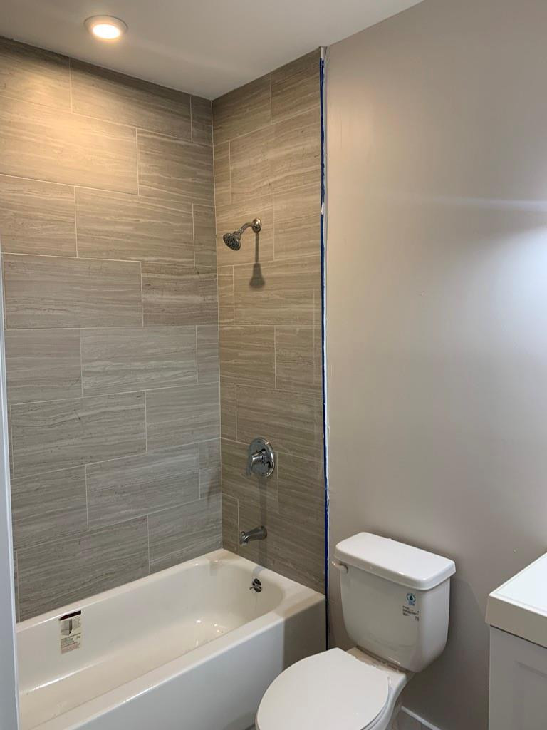 309 Foster Road, Unit 7 Hallandale Beach, FL 33009 - Photo 35 of 53 a white toilet sitting next to a bath tub