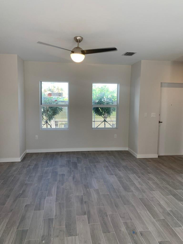 309 Foster Road, Unit 7 Hallandale Beach, FL 33009 - Photo 37 of 53 wooden floor in an empty room with a window