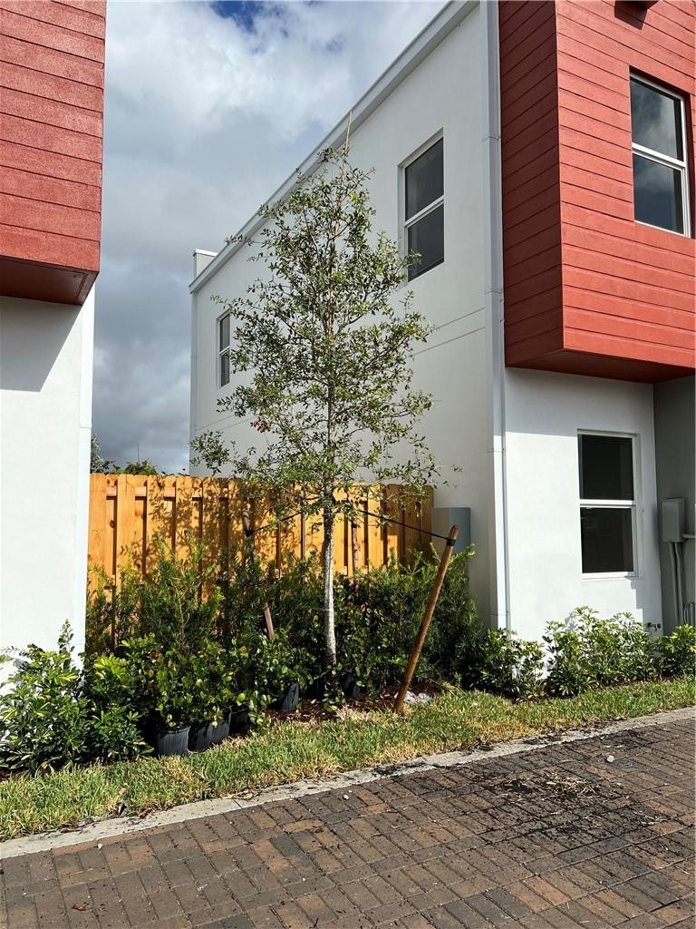 309 Foster Road, Unit 7 Hallandale Beach, FL 33009 - Photo 4 of 53 a view of a house with a yard