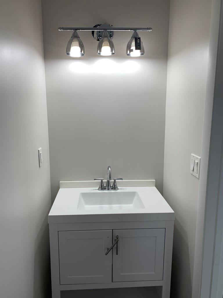 309 Foster Road, Unit 7 Hallandale Beach, FL 33009 - Photo 43 of 53 a sink with a mirror