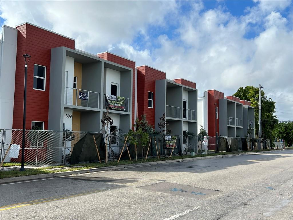 309 Foster Road, Unit 7 Hallandale Beach, FL 33009 - Photo 5 of 53 a front view of a building with street view