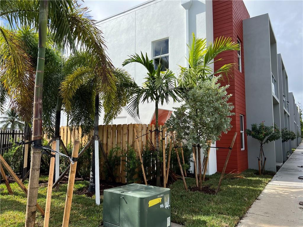 309 Foster Road, Unit 7 Hallandale Beach, FL 33009 - Photo 7 of 53 a house with a tree in front of it