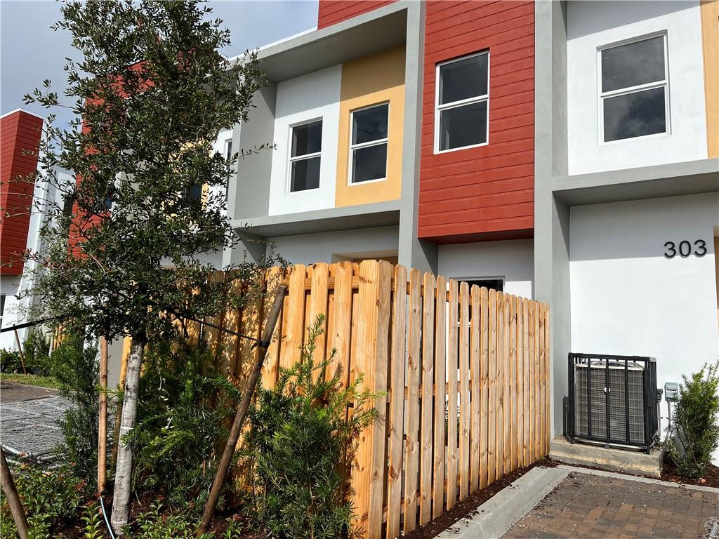 309 Foster Road, Unit 7 Hallandale Beach, FL 33009 - Photo 10 of 53 a view of building with a tree