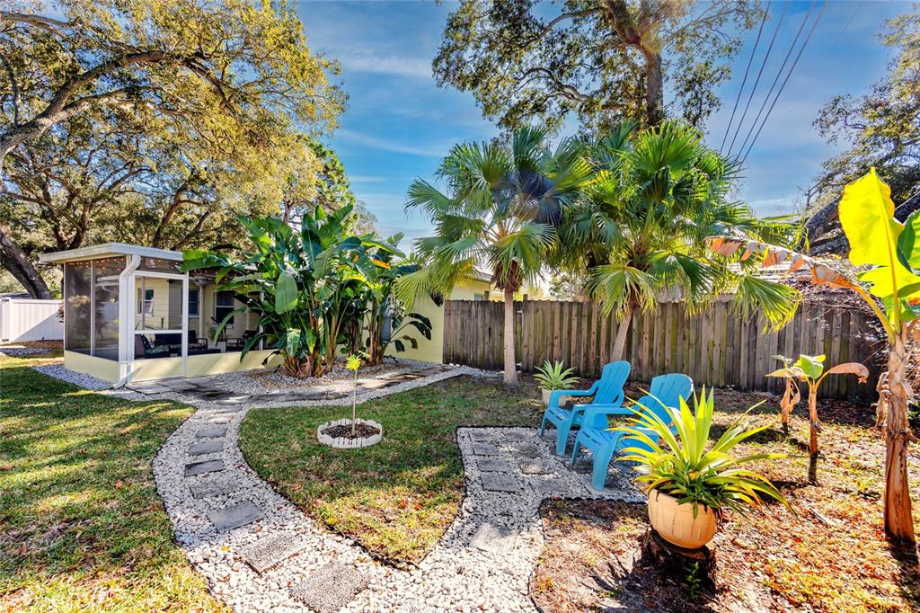 5596 100th Way North St. Petersburg, FL 33708 - Photo 61 of 67 a view of a backyard with plants and garden