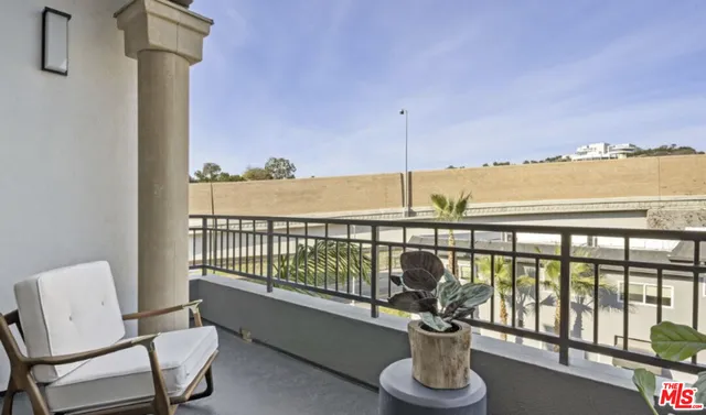 a view of a balcony with chair