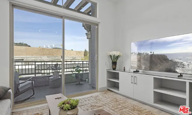 a outdoor space with a large window and furniture