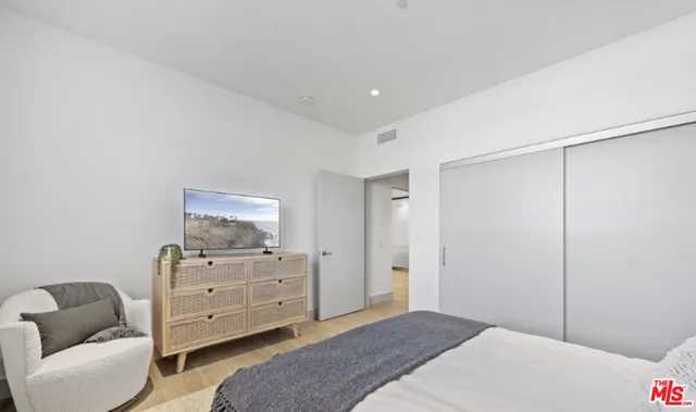 a bedroom with a bed and furniture