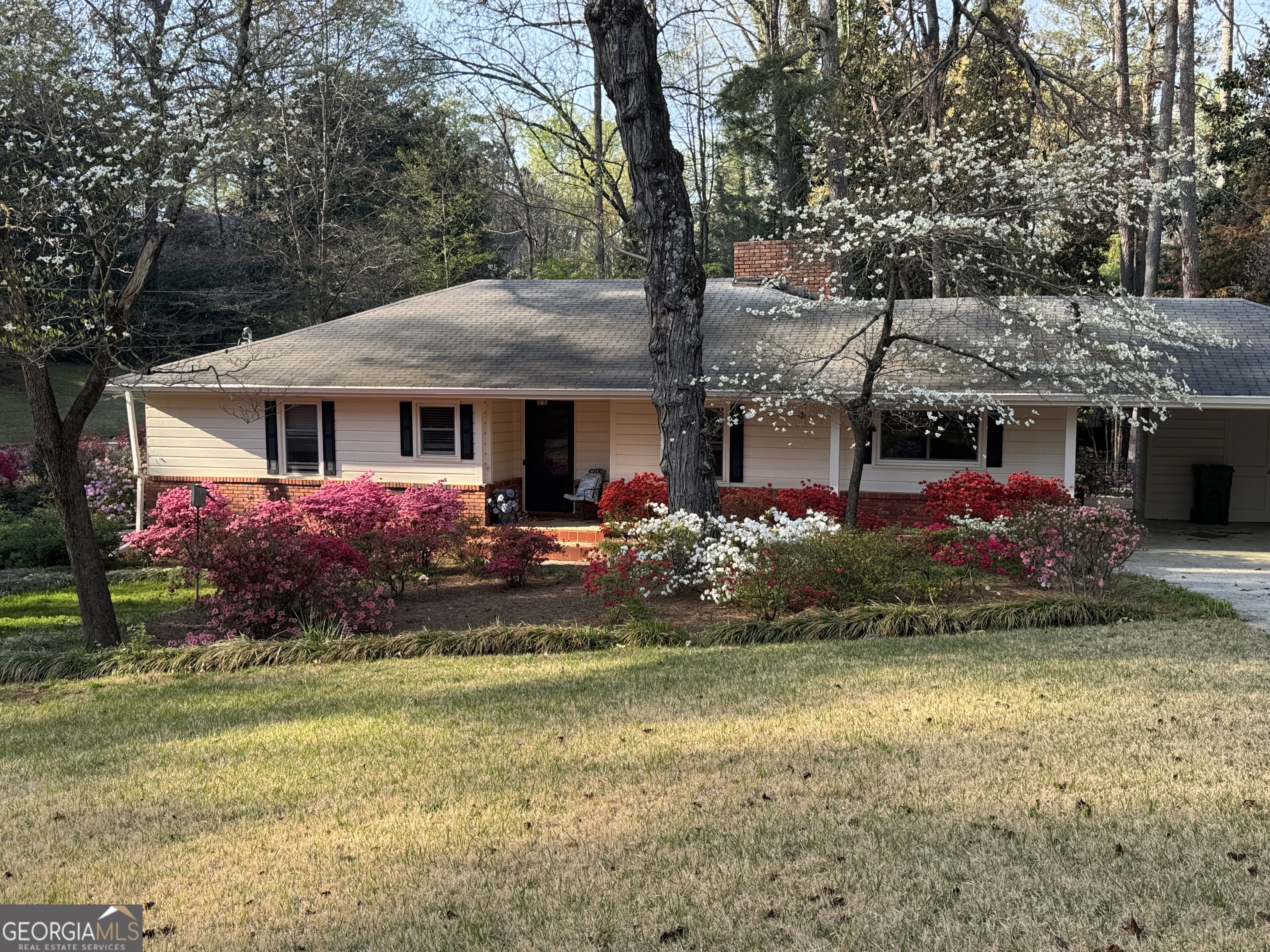 a front view of a house with garden