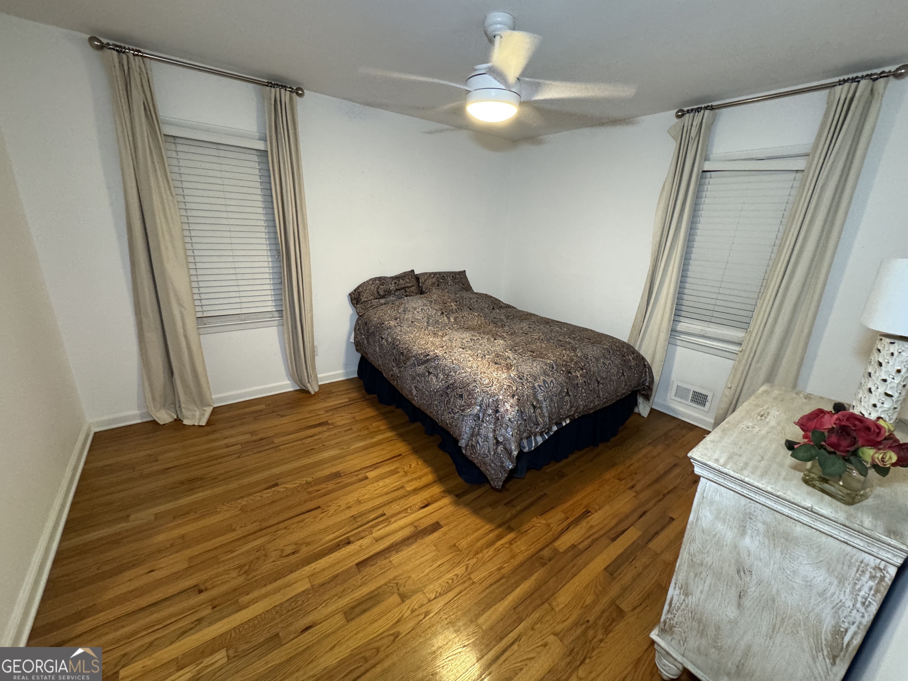 2352 Leafmore Drive Decatur, GA 30033 - Photo 18 of 28 a bedroom with a bed chandelier and a window