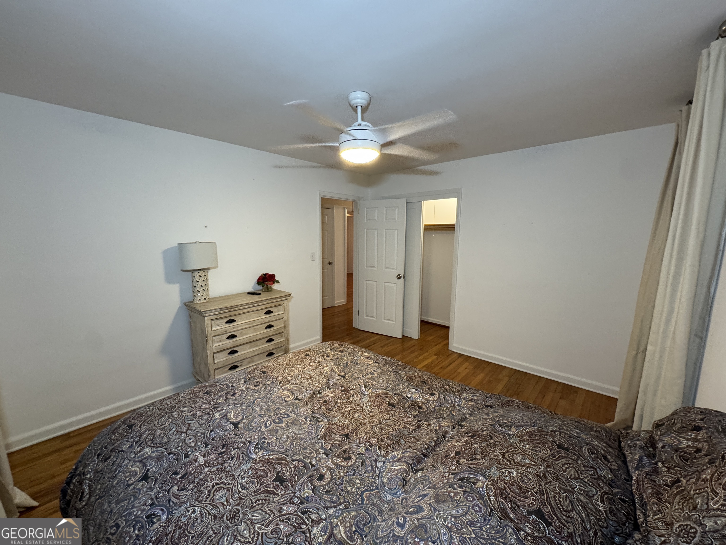 2352 Leafmore Drive Decatur, GA 30033 - Photo 19 of 28 a room with a bed and a chandelier
