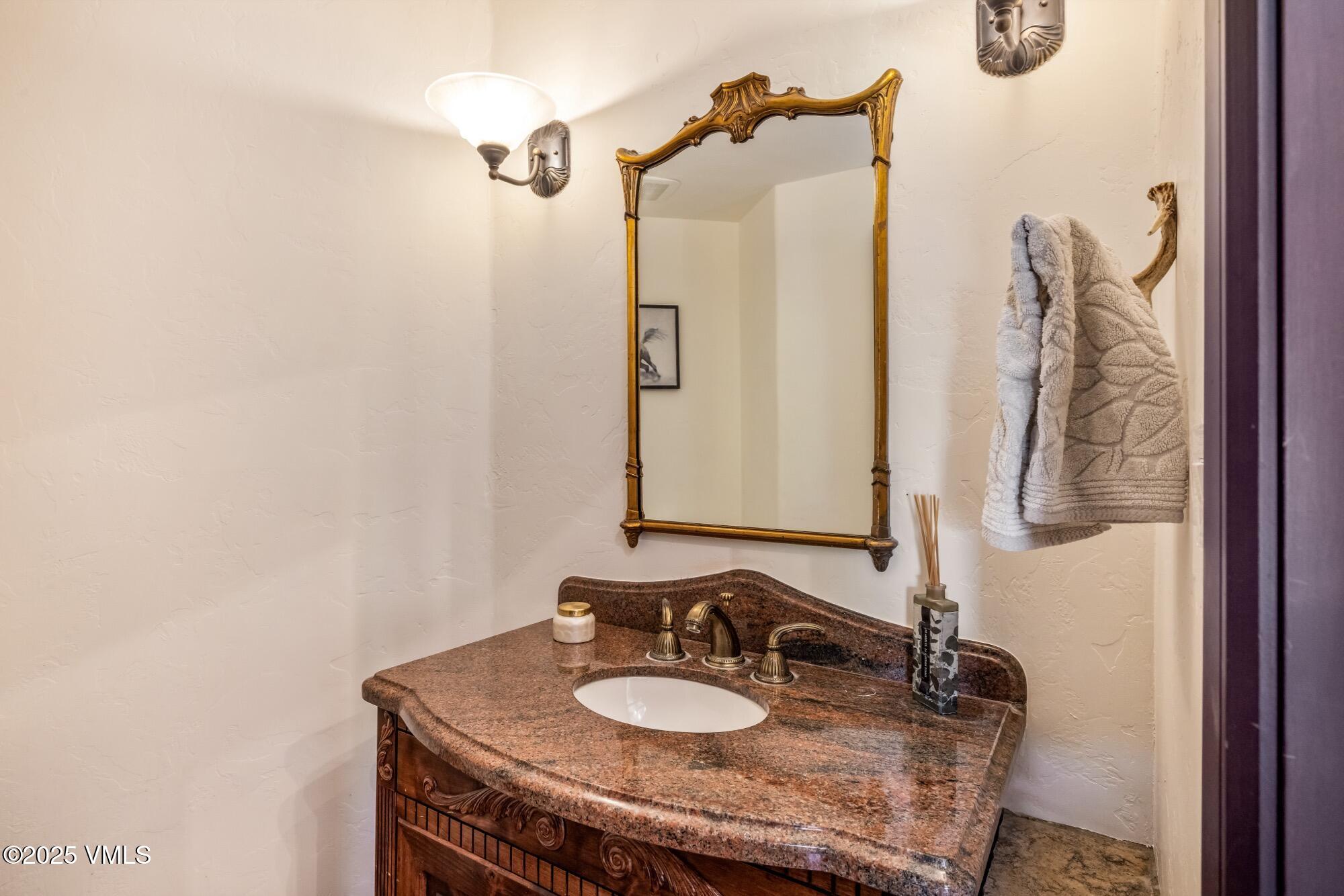 1122 Red Draw Edwards, CO 81632 - Photo 51 of 54 a bathroom with a granite countertop sink and a mirror