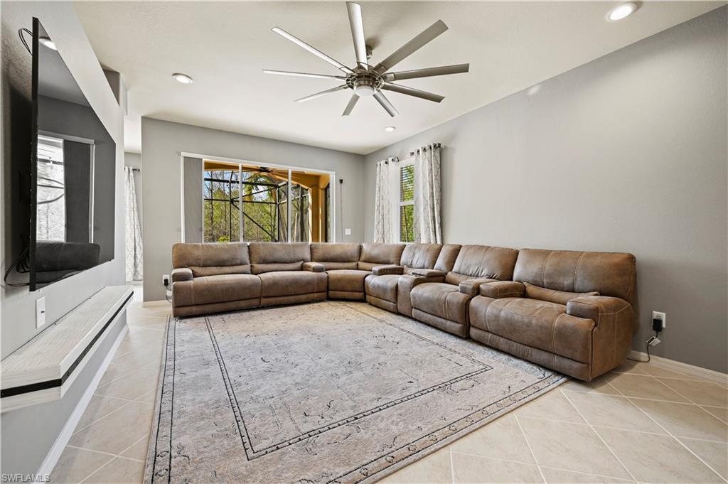 20686 Larino Loop Estero, FL 33928 - Photo 11 of 47 a living room with furniture and a flat screen tv