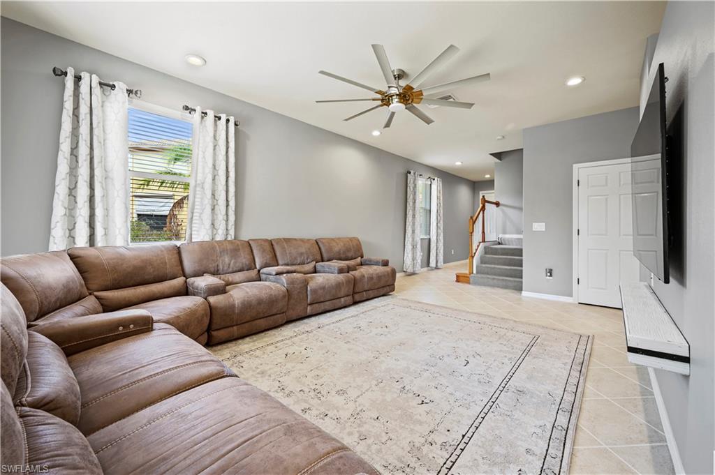 20686 Larino Loop Estero, FL 33928 - Photo 12 of 47 a living room with furniture and a flat screen tv