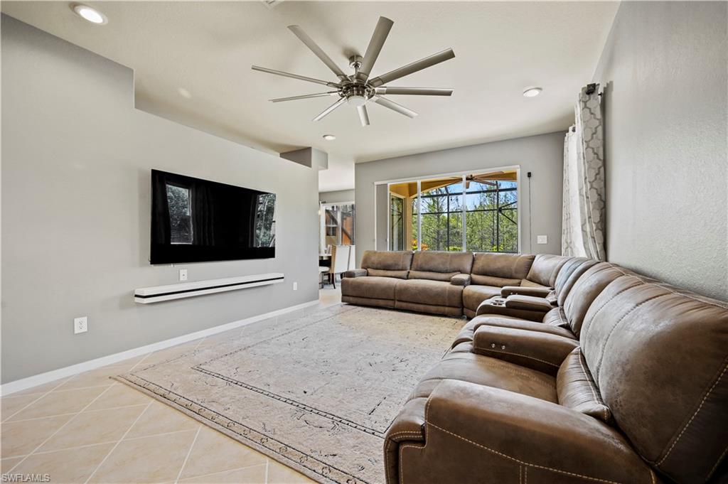 20686 Larino Loop Estero, FL 33928 - Photo 14 of 47 a living room with furniture a ceiling fan and a window