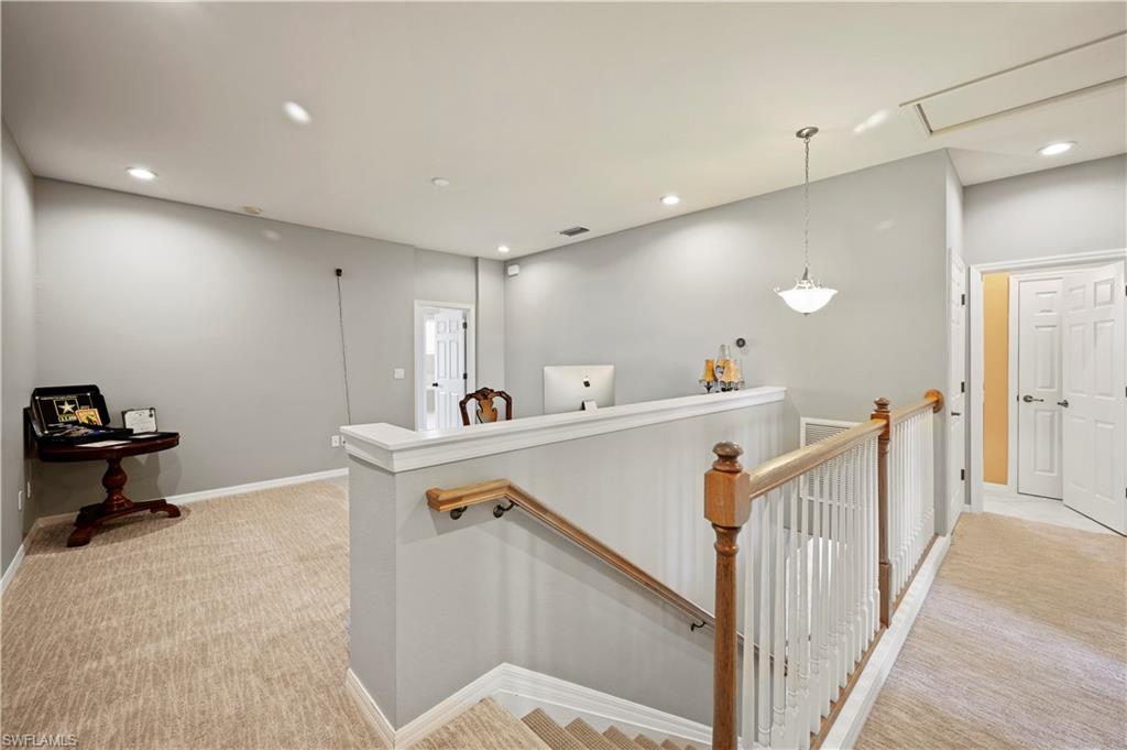 20686 Larino Loop Estero, FL 33928 - Photo 16 of 47 a view of a hallway with workspace