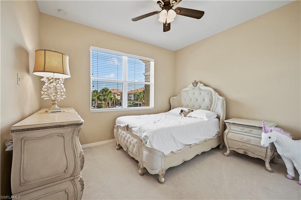 20686 Larino Loop Estero, FL 33928 - Photo 23 of 47 a bedroom with a bed and a window