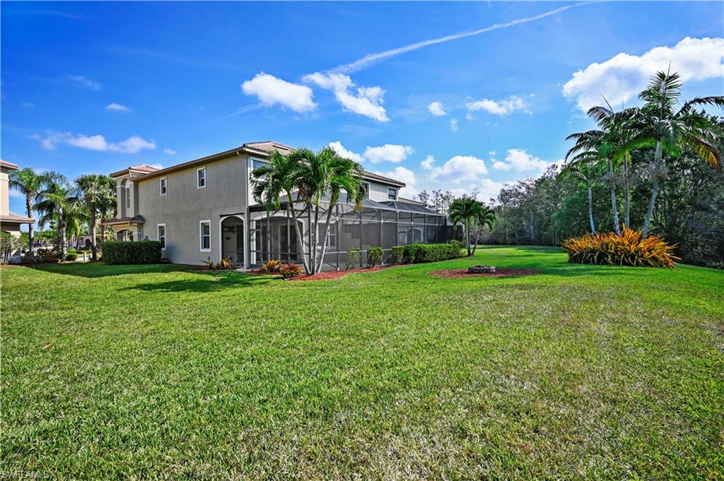 20686 Larino Loop Estero, FL 33928 - Photo 27 of 47 a view of a house with backyard and sitting area