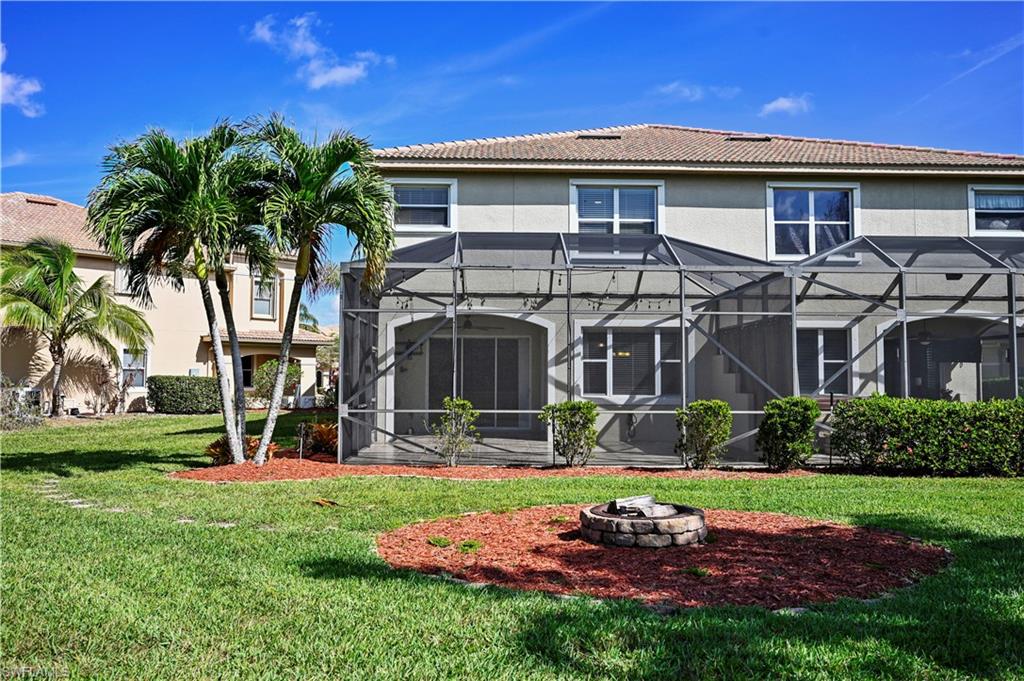 20686 Larino Loop Estero, FL 33928 - Photo 29 of 47 a view of a house with a yard