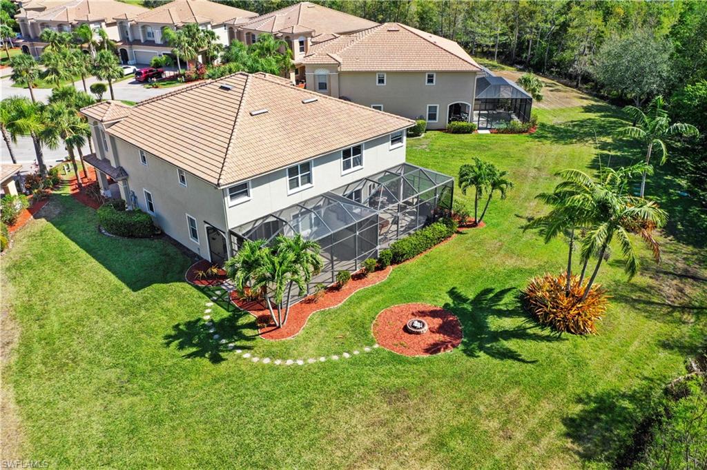 20686 Larino Loop Estero, FL 33928 - Photo 3 of 47 front view of a house with a big yard