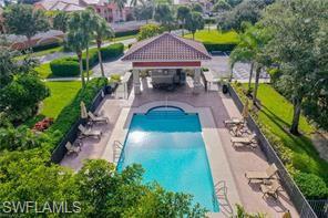 20686 Larino Loop Estero, FL 33928 - Photo 45 of 47 an aerial view of a house with swimming pool and garden