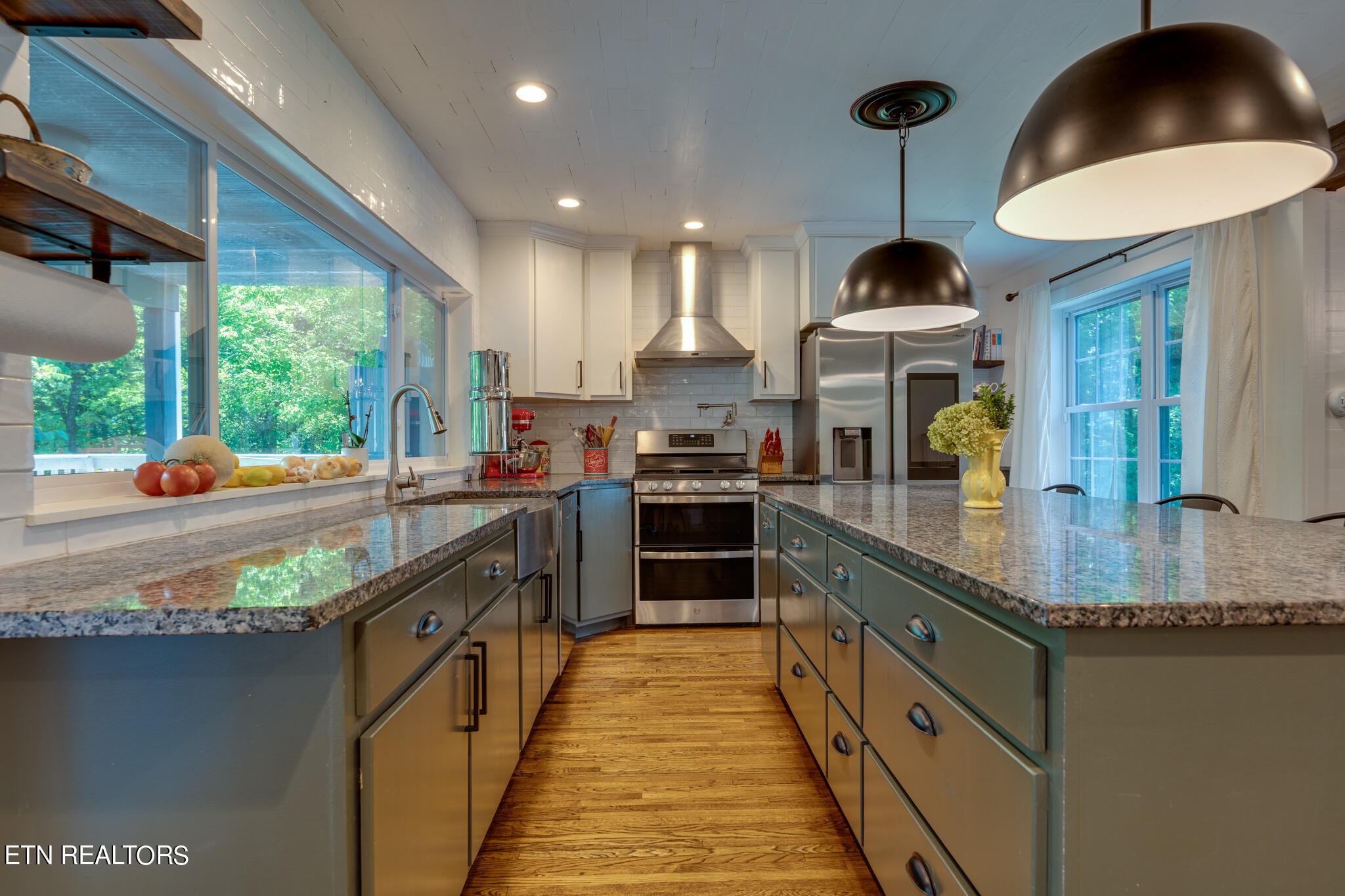 818 McCammon Road Knoxville, TN 37920 - Photo 6 of 60 a kitchen with stainless steel appliances granite countertop a sink a stove and a wooden floors