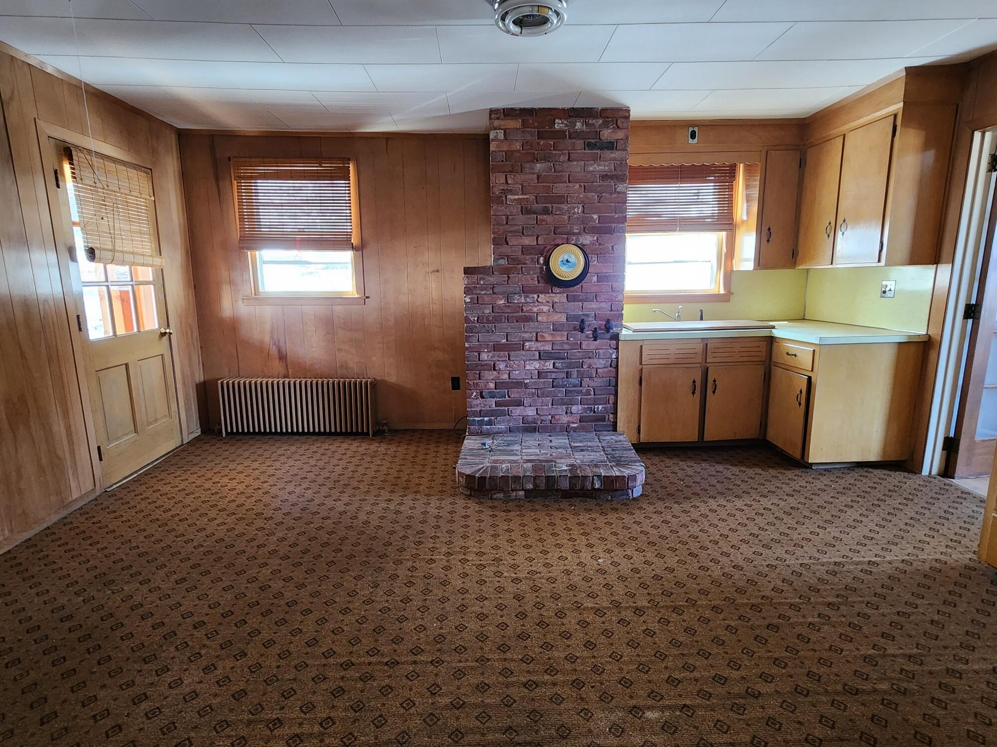 12 Backfield Road Rumford, ME 04276 - Photo 4 of 33 4 Dining Room with Brick Hearth and Cabi