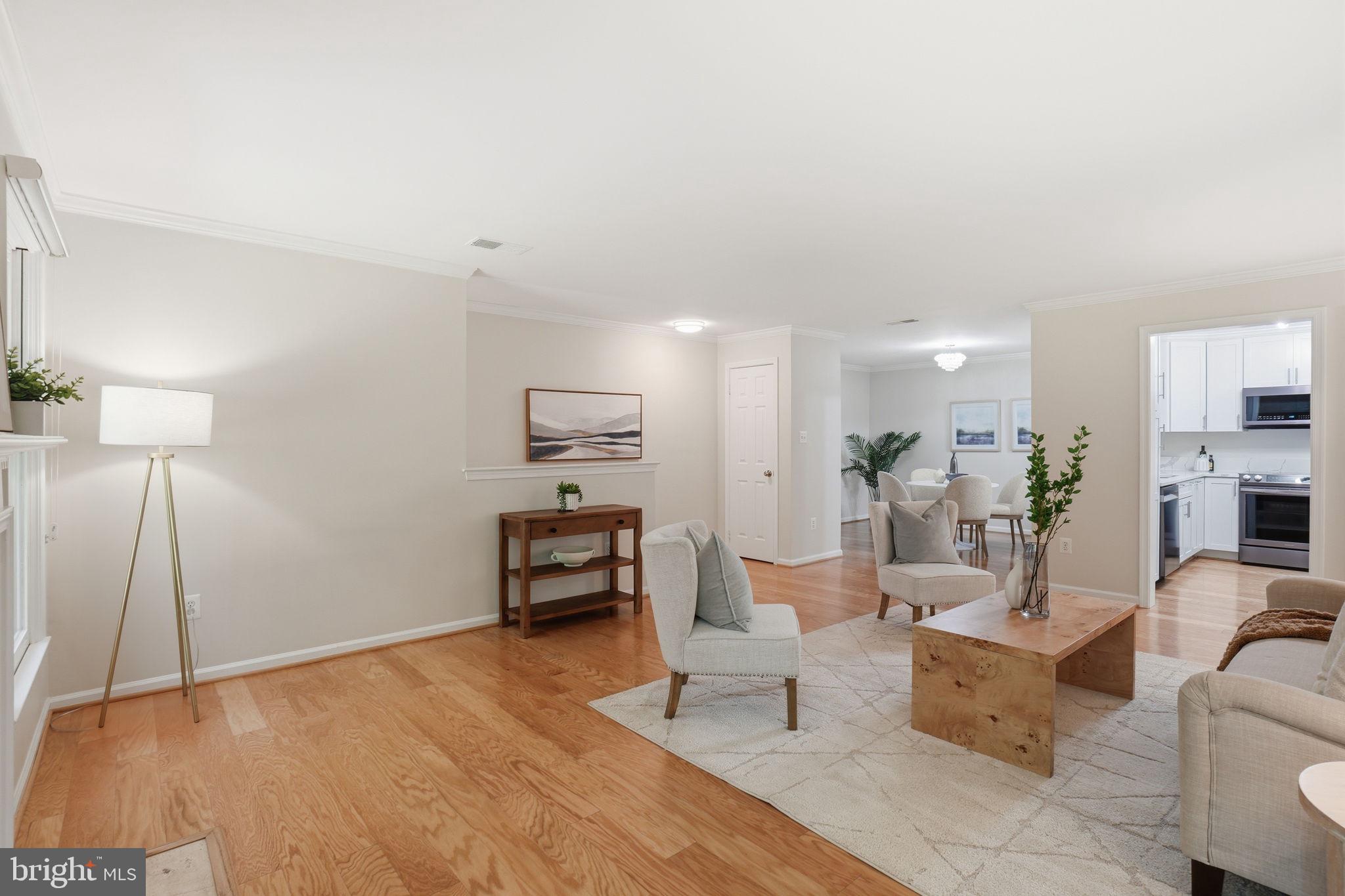 1495 Church Hill Place Reston, VA 20194 - Photo 8 of 27 a living room with furniture wooden floor and a table