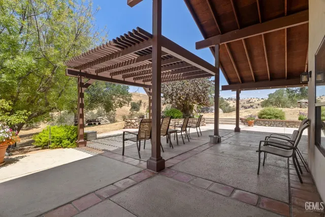 a view of a terrace with trees