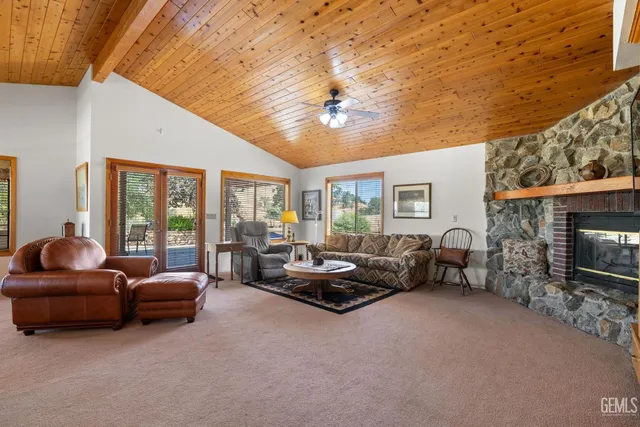 a kitchen with stainless steel appliances granite countertop furniture and a refrigerator