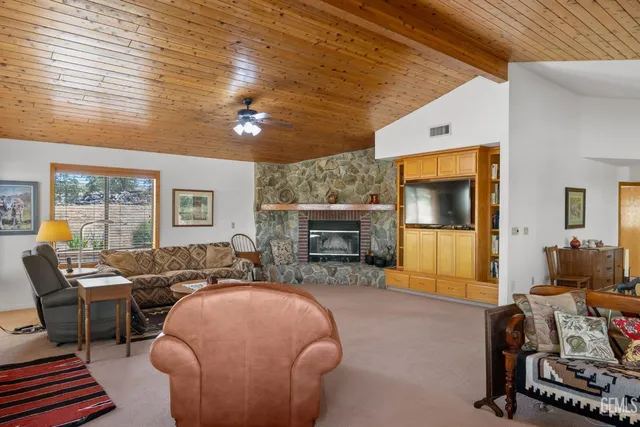 a kitchen with stainless steel appliances granite countertop a sink and a refrigerator