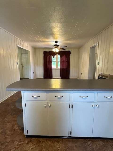 1323 Cavender Creek Road Dahlonega, GA 30533 - Photo 14 of 56 a view of a kitchen with cabinets and wooden floor