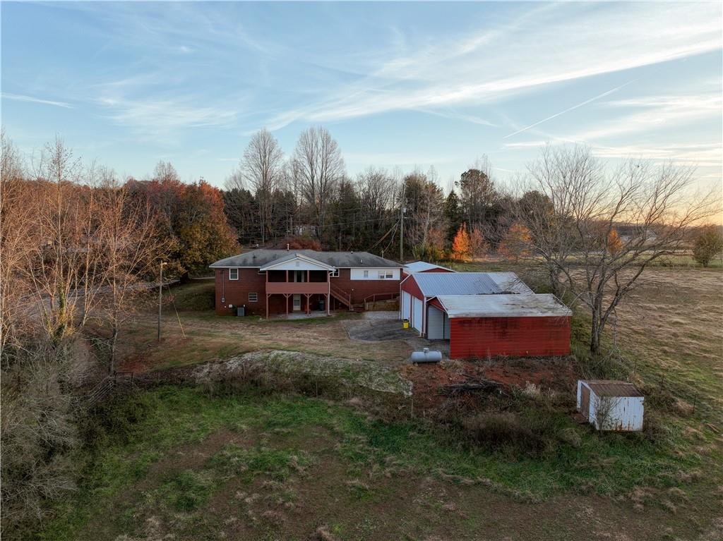 1323 Cavender Creek Road Dahlonega, GA 30533 - Photo 55 of 56 a view of a houses with yard and mountain view in back