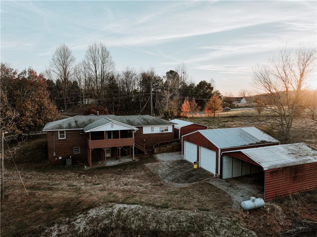 1323 Cavender Creek Road Dahlonega, GA 30533 - Photo 56 of 56 a view of a house with a yard and sitting area