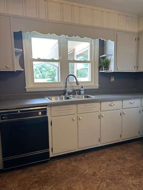 1323 Cavender Creek Road Dahlonega, GA 30533 - Photo 10 of 56 a kitchen with granite countertop white cabinets white appliances and a sink