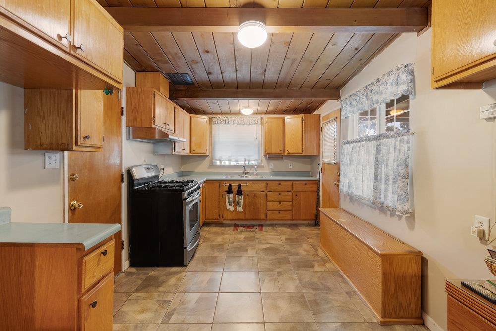 718 Meadow Drive Salinas, CA 93905 - Photo 4 of 14 a kitchen with stainless steel appliances granite countertop a stove a sink and a refrigerator