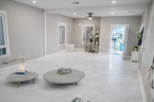 a view of a livingroom with furniture and white walls