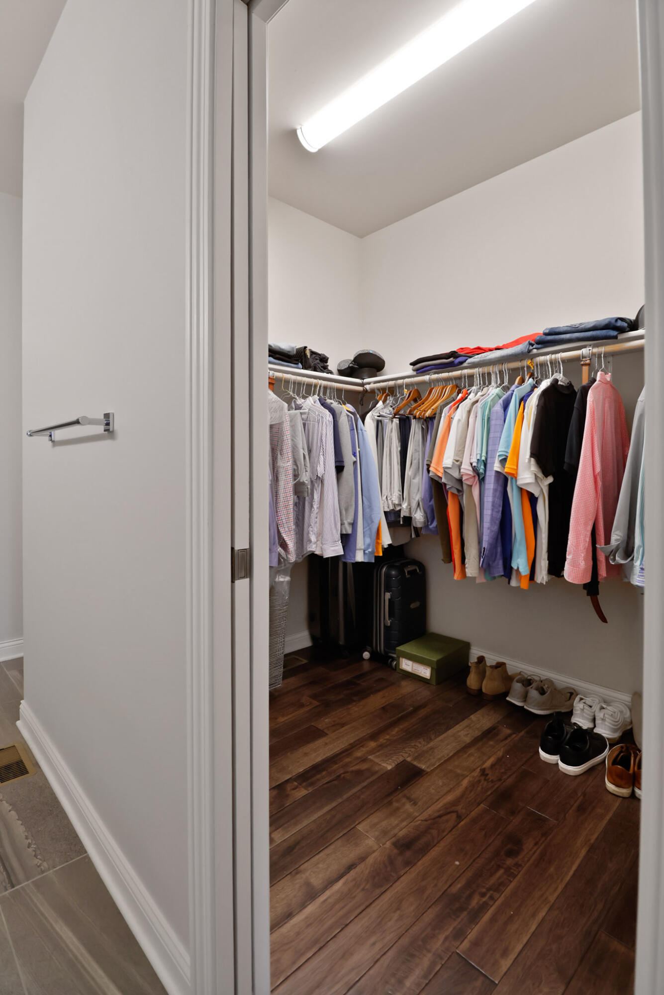 10188 Azalea Drive Crown Point, IN 46307 - Photo 17 of 29 a view of walk in closet with clothes and shoes