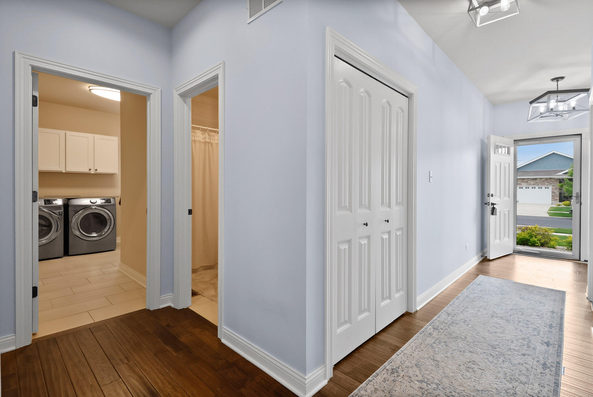 10188 Azalea Drive Crown Point, IN 46307 - Photo 23 of 29 a view of a hallway with wooden floor and a living room
