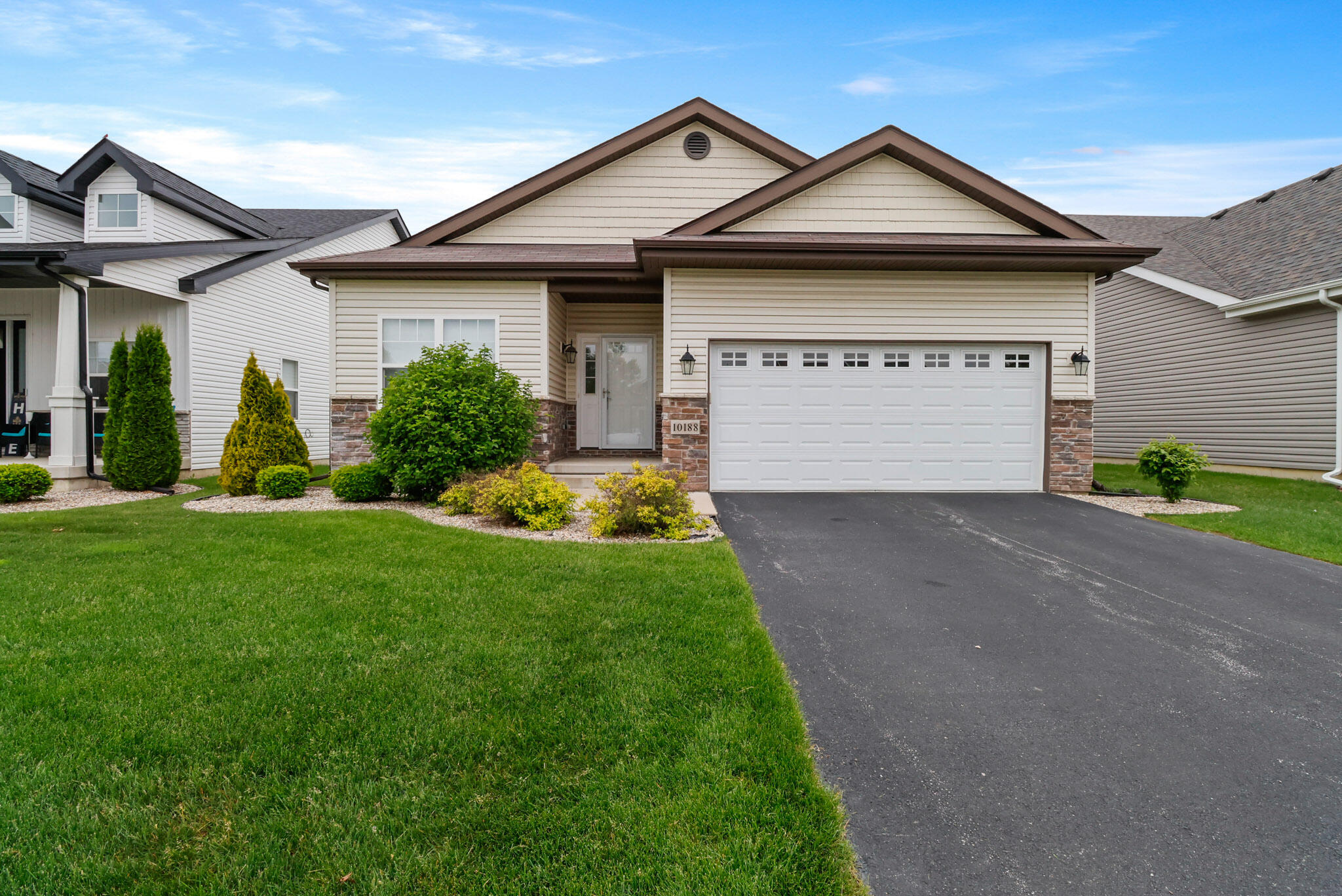 10188 Azalea Drive Crown Point, IN 46307 - Photo 29 of 29 a front view of a house with a garden and plants