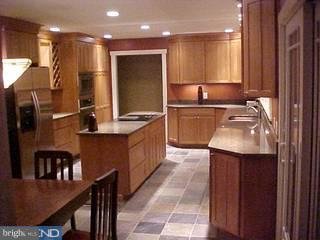 103 Meetinghouse Road Doylestown, PA 18901 - Photo 3 of 4 a kitchen with kitchen island granite countertop a sink counter top space and stainless steel appliances