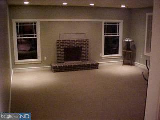 103 Meetinghouse Road Doylestown, PA 18901 - Photo 4 of 4 a living room with a fireplace
